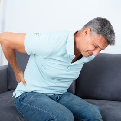 Chiropractor in Omaha showing patient with back pain